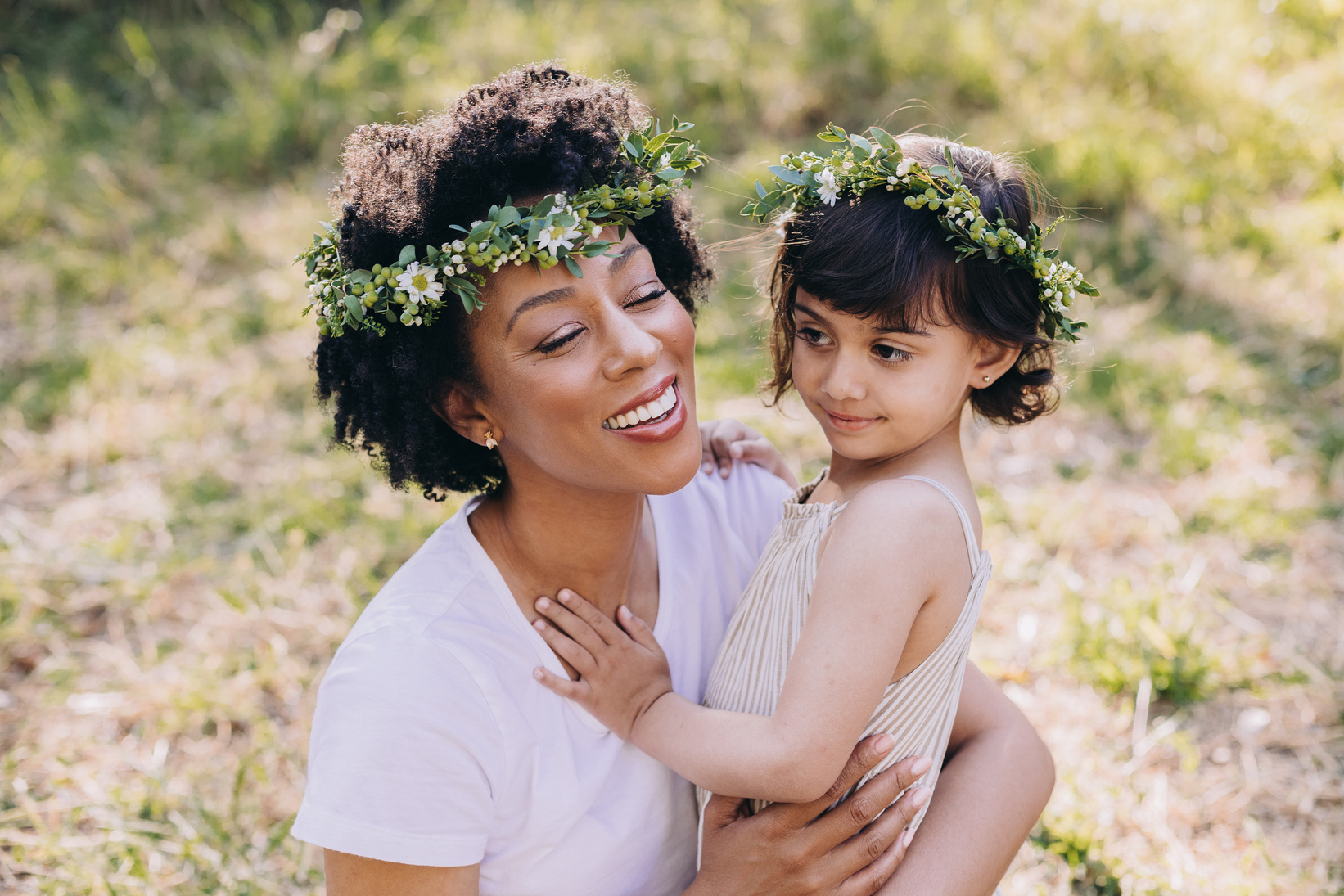 Mother and Daughter with Flower Crowns Outdoors